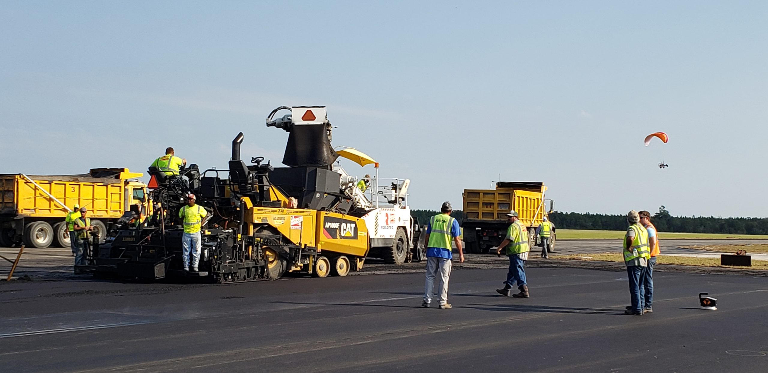 Asphalt crews and equipment at Keystone Airport applying StellarFlex FR to the tarmac.