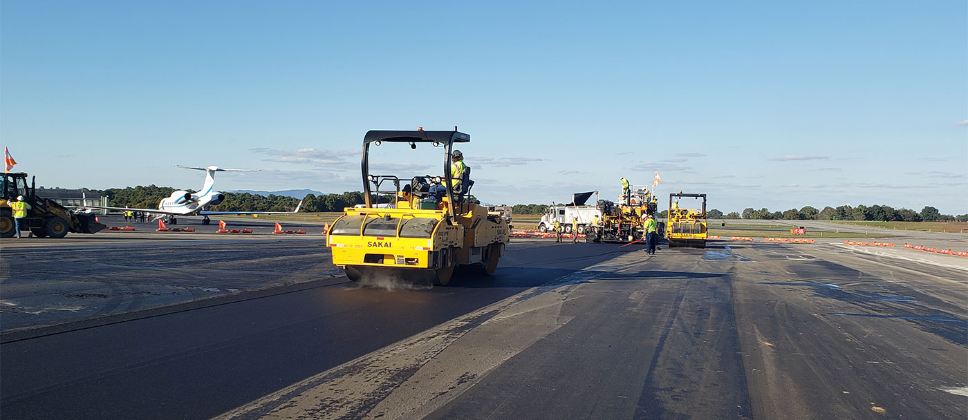 A roller smoothing asphalt on a airport tarmac at Lynchburg Regional Airport in Virginia.