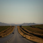 paved road, single car on an open road on iceland, long paved road, liquid asphalt road, asphalt roadways